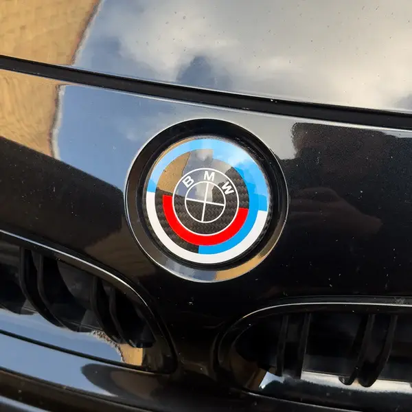 BMW-50th-Anniversary-Carbon-Fibre-Badge-Overlays-Twenty-Two-Tuning-XXIITUNING-Original.webp